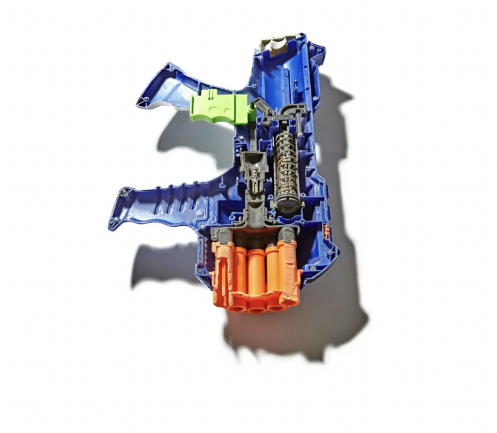 An image of a Nerf gun that's been cut in half. 