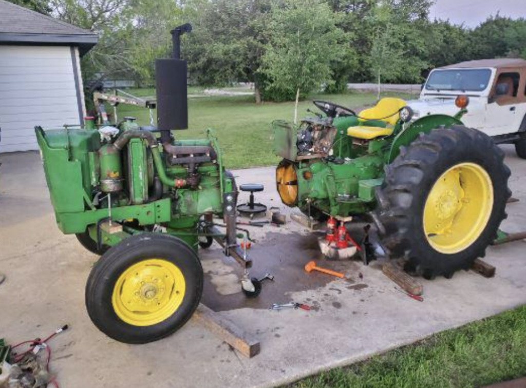 An image of a tractor that's been cut in half for a clutch change. 