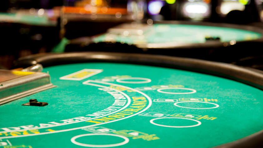 An image of a well lit poker table.