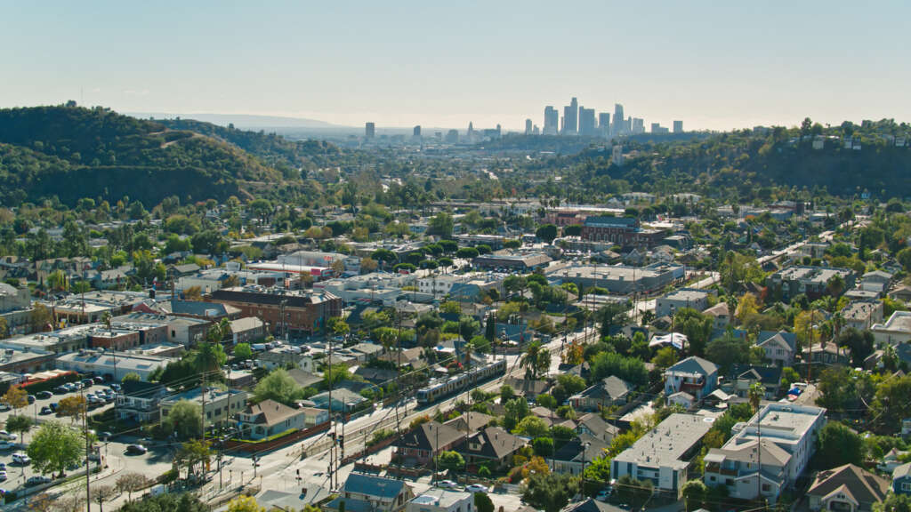 A drone shot of Los Angeles on a blue sky day. 