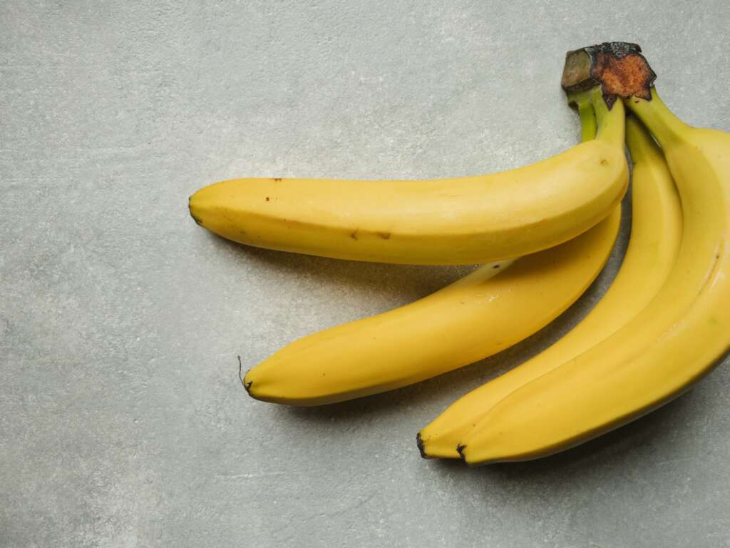 A group of bananas that have been placed on a countertop. 