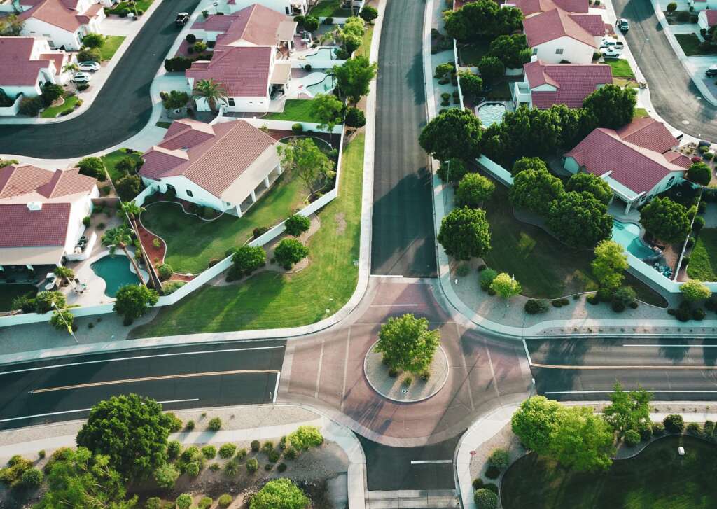 An overhead image of a ton of houses in a beautiful neighborhood. 