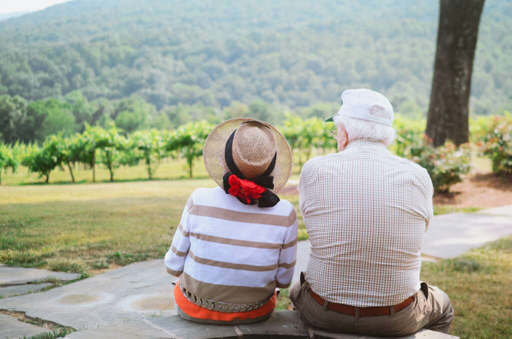An image of a couple looking at a grove. 