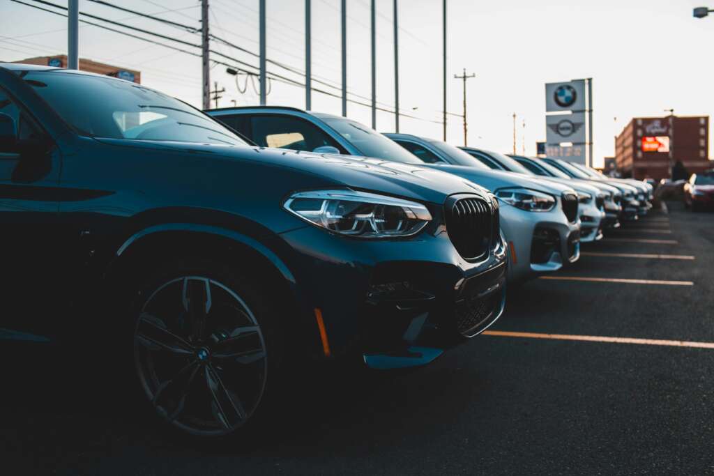 An image of cars lined up at a car dealership.
