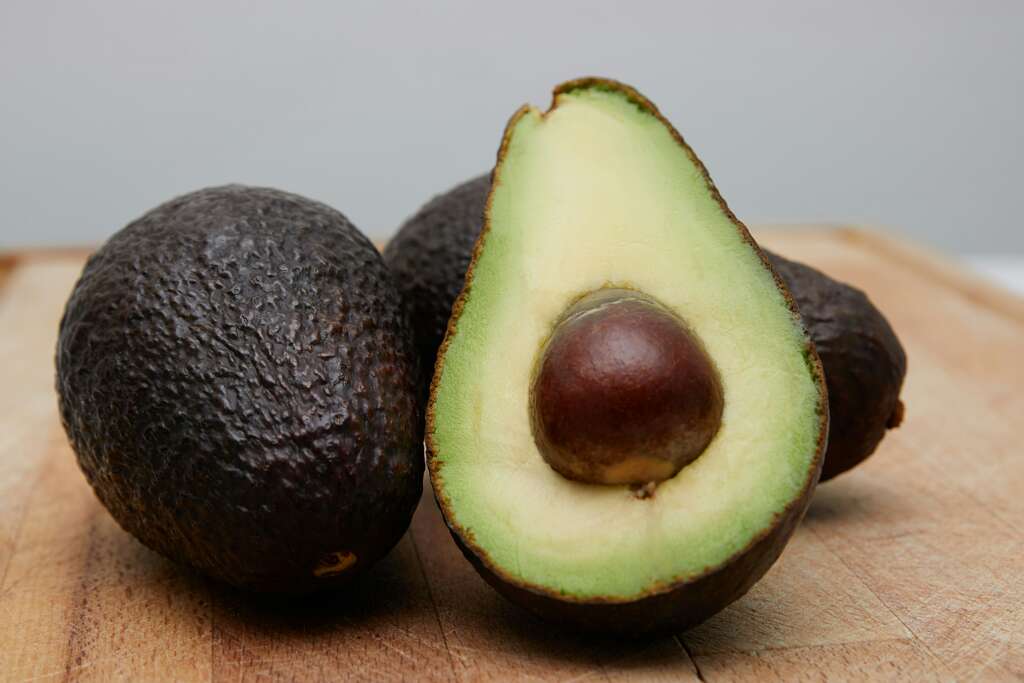 A close-up image of a cut up avocado. 