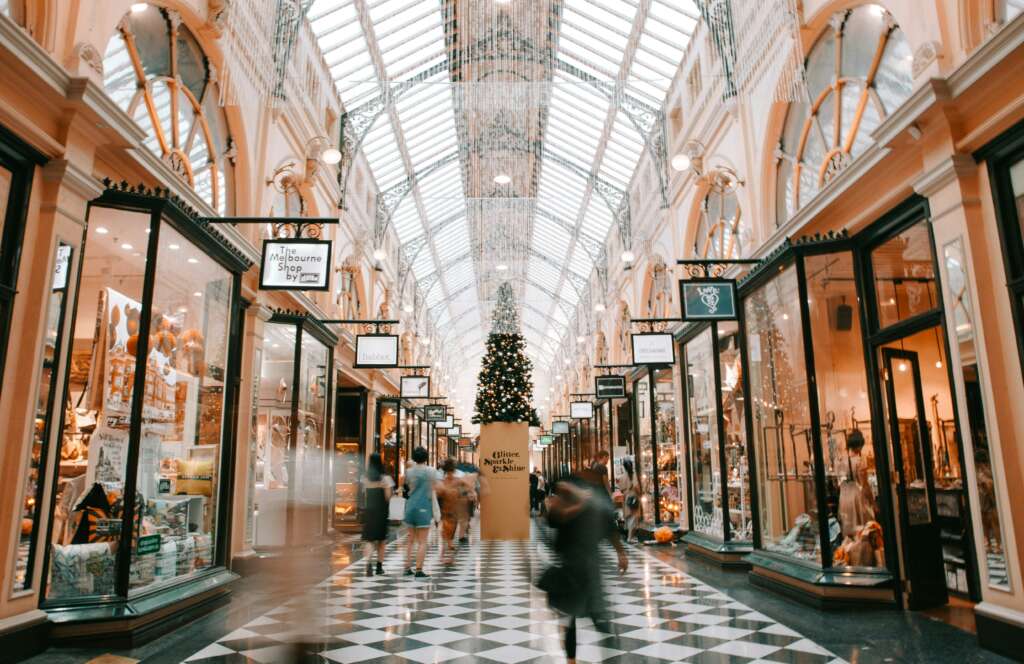 An image of shops in a mall at Christmas time. 