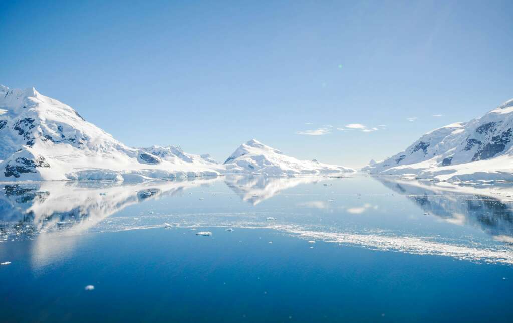 A beautiful image of an icy landscape with a blue sky overhead. 