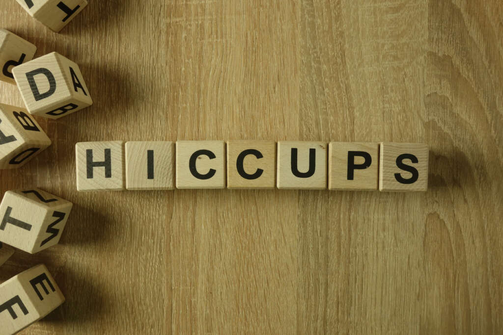 An image of someone who used letter blocks to spell out "hiccups."