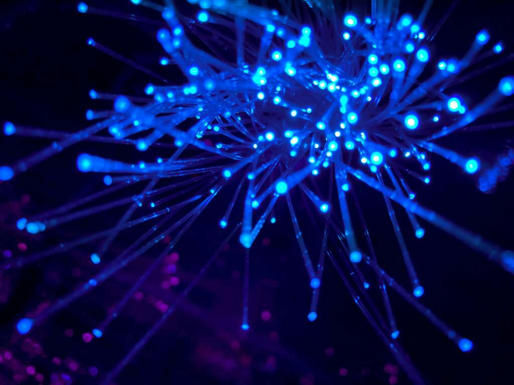 An image of the internet represented through blue-lit wires. 