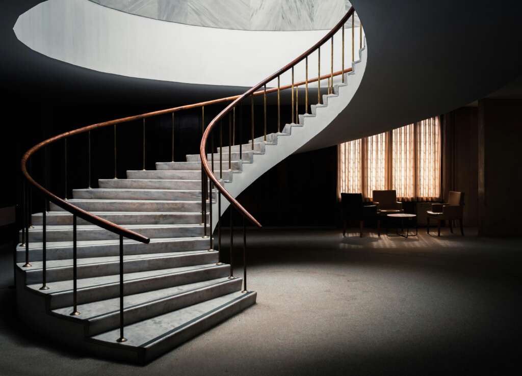 An image of a well lit and giant staircase. 