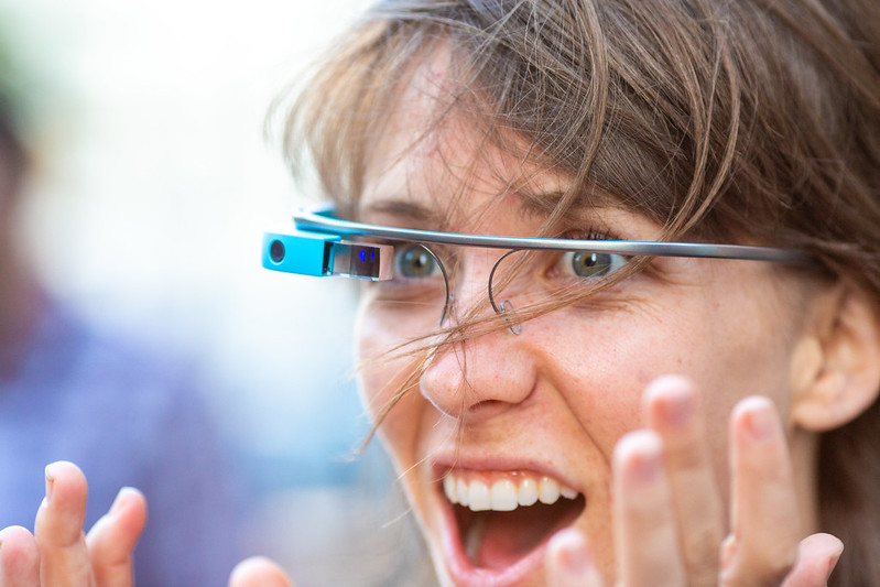 An image of someone using a Google Glass and being very excited about it.