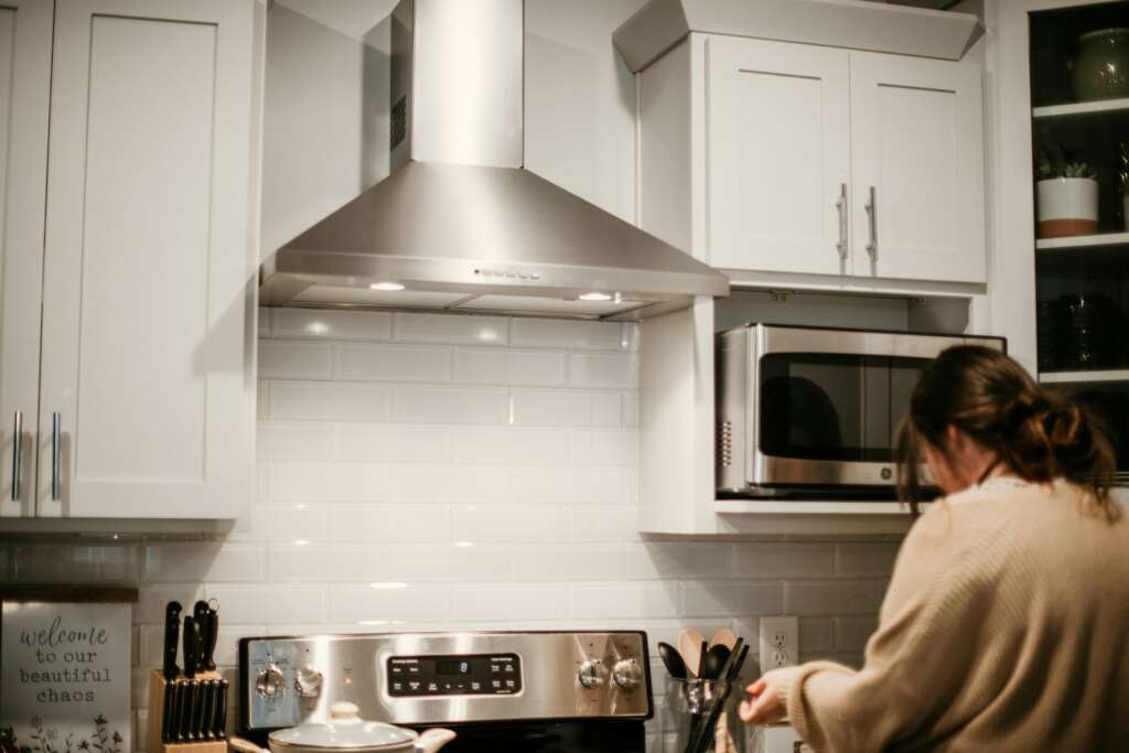 An image of someone preparing food in a kitchen. 