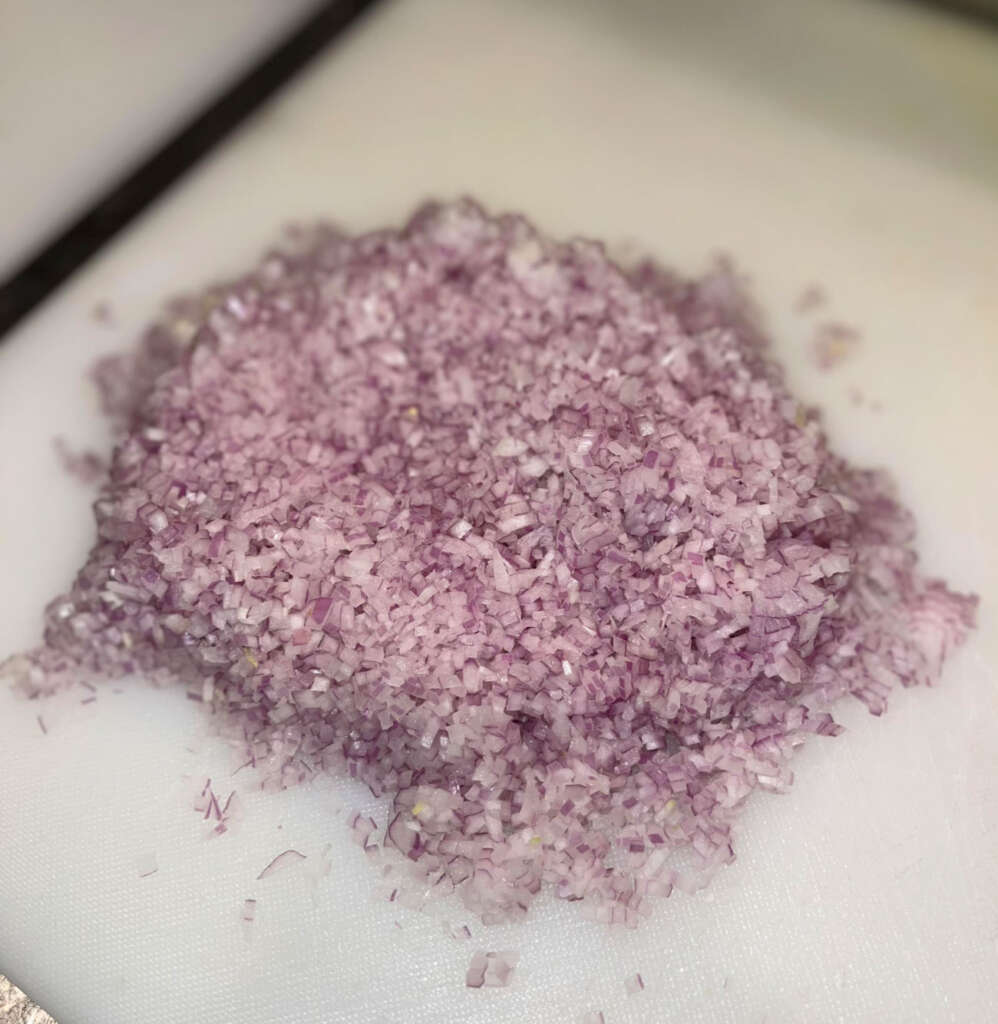 An image of shallots that have been meticulously diced. 