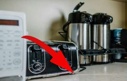 A red arrow pointing to hidden product feature on most microwaves.