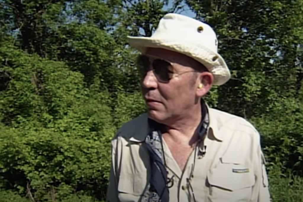 An image of Hunter S. Thompson as a much older man with a hunting hat on. 