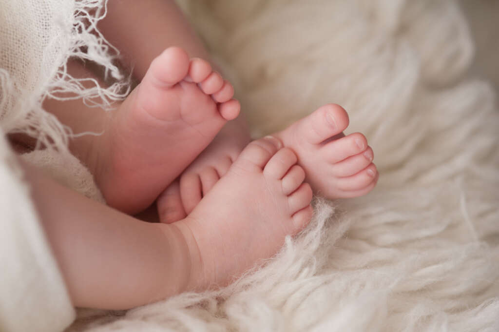 An image of twins' baby feet. 