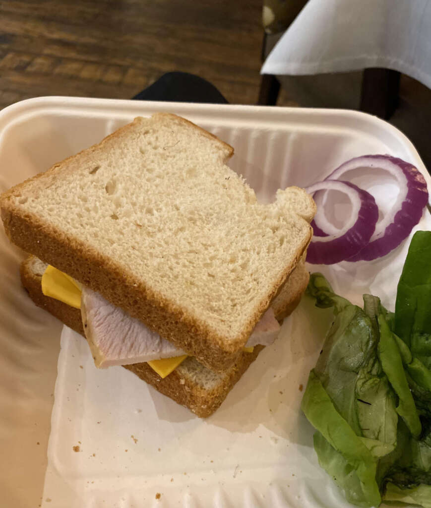 An image of a Thanksgiving sandwich that was put together with no care. 