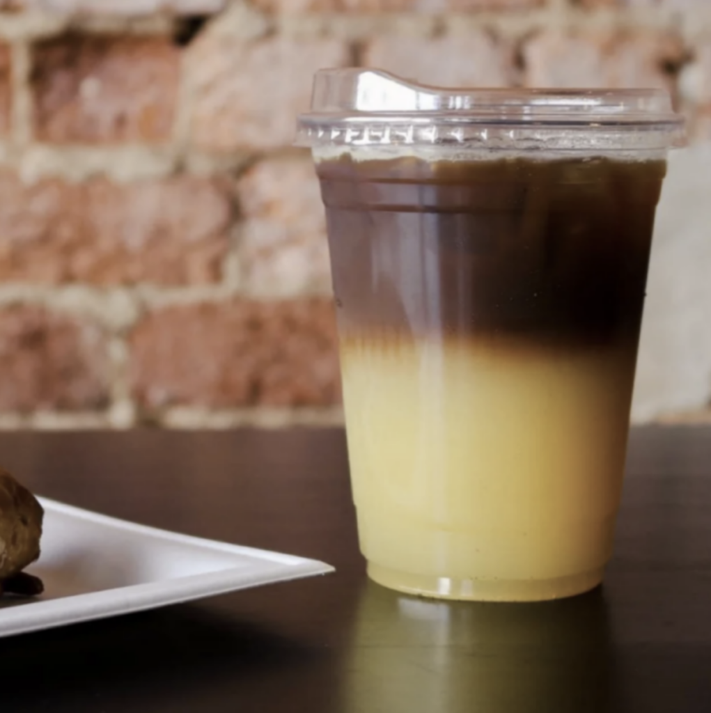 An image of an espresso and orange juice combination drink.