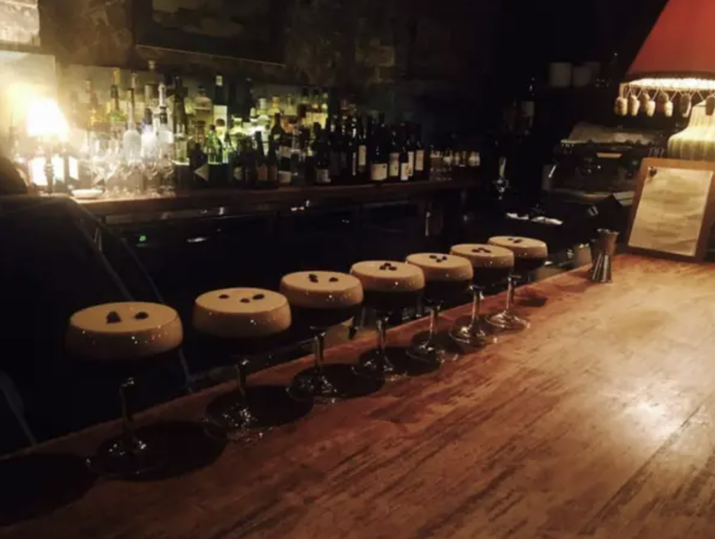 A line of espresso martinis that look like barstools. 