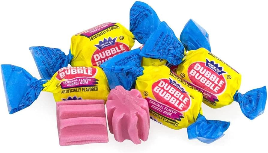 Several wrapped pieces of Dubble Bubble chewing gum with blue and yellow wrappers lie next to a few unwrapped pieces of pink bubble gum showing their rectangular shape and grooves.