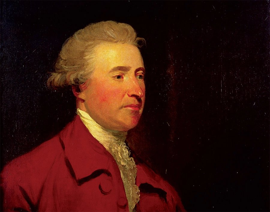 A formal painted portrait of a distinguished individual with short, light-colored hair, wearing a dark red coat and a white cravat. The background is dark, which highlights the subject's focused, slightly side-facing expression.