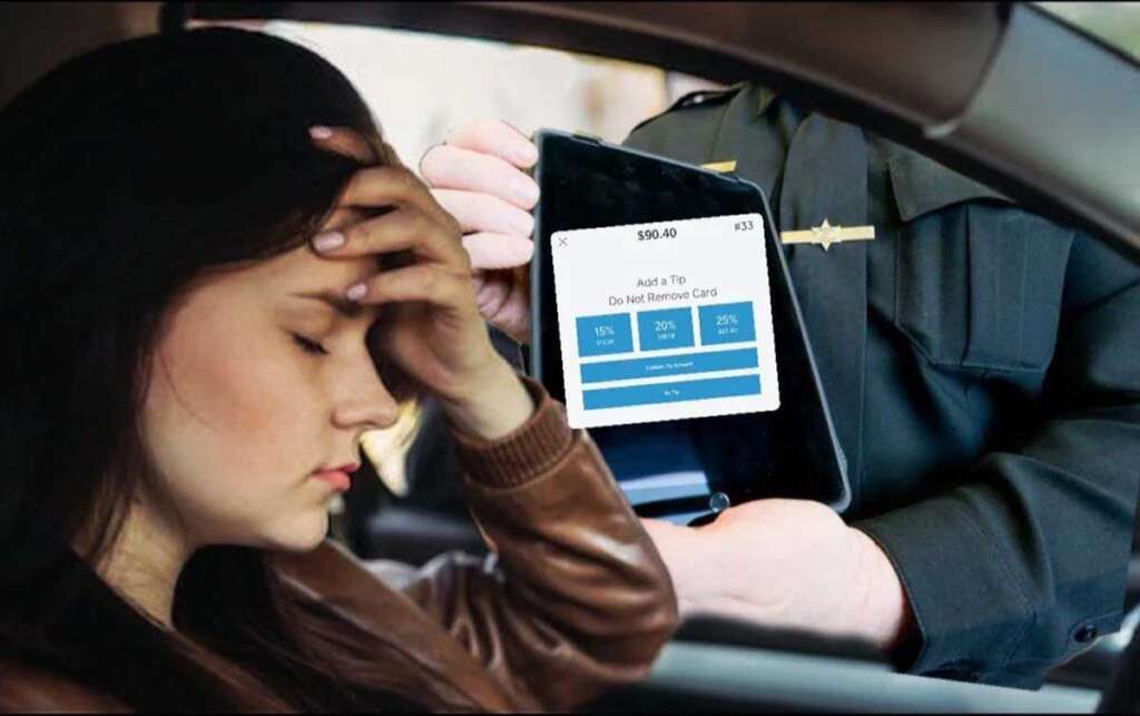 Woman looking annoyed while a police officer holds an ipad asking if she would like to tip