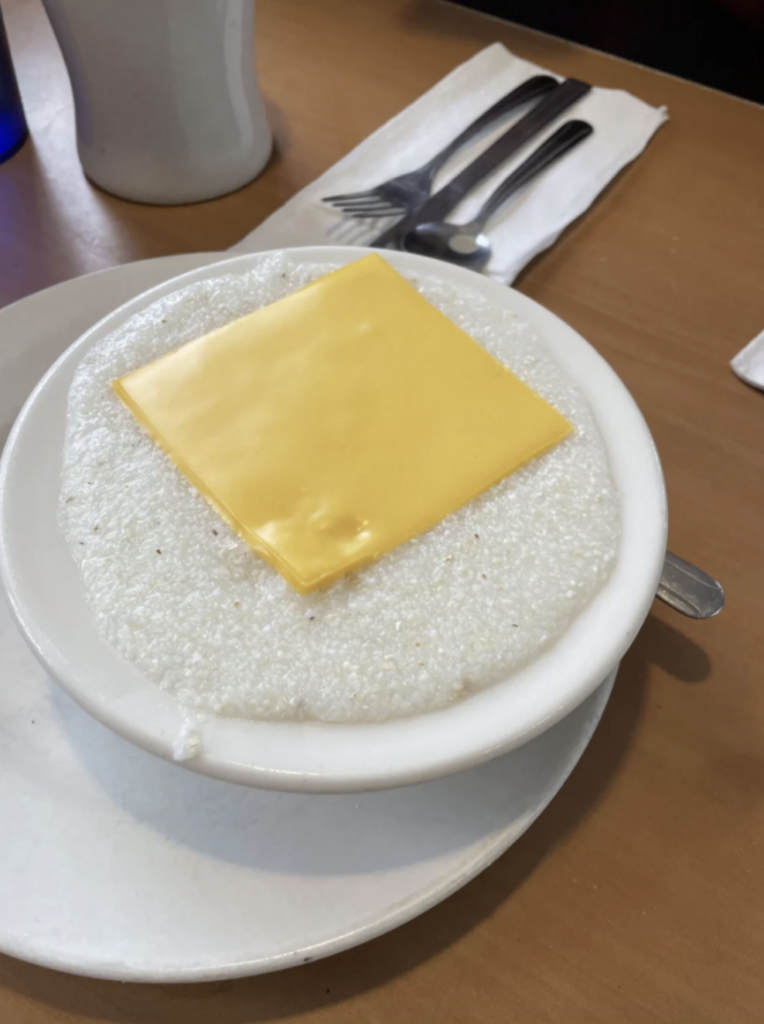 An image of gross grits and cheese slice. 