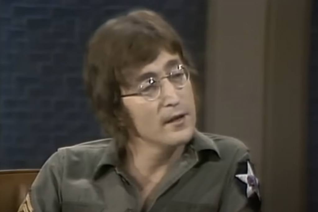 An image of John Lennon being interviewed. 