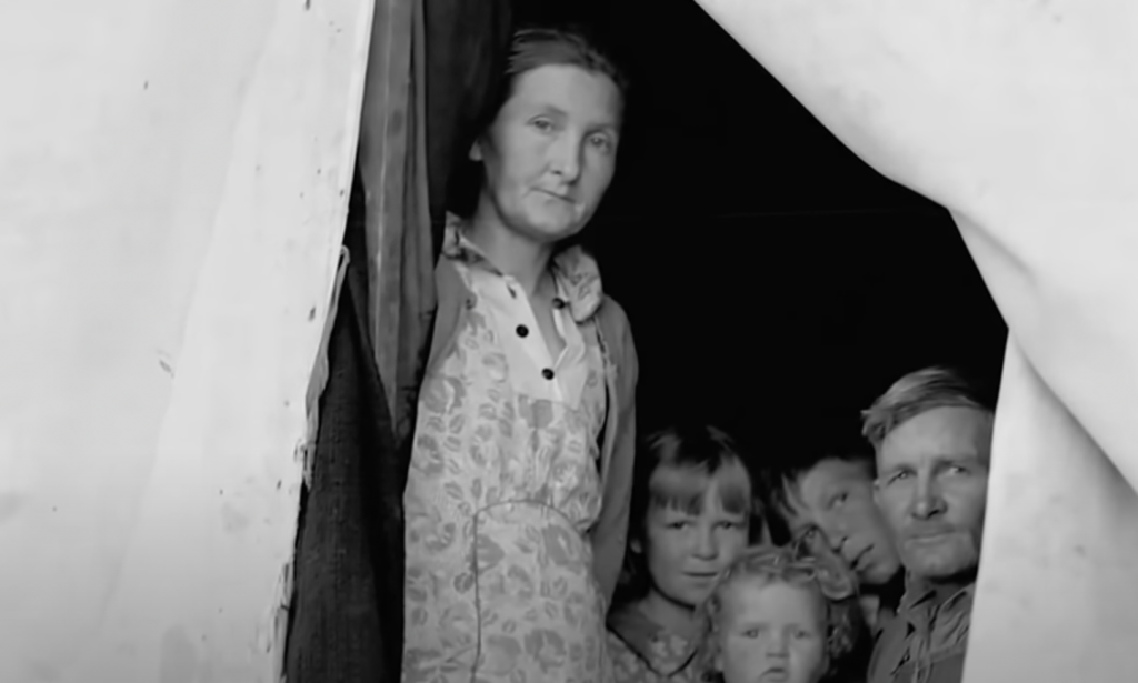 Black and white photo of a family from the old days. 