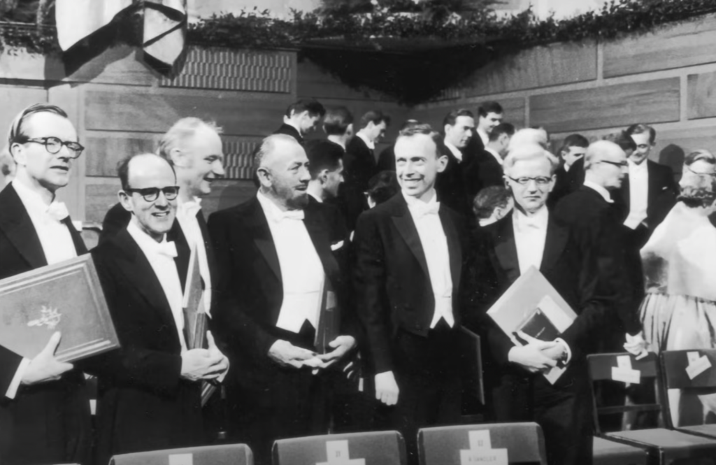 John Steinbeck and colleagues at a formal suit and tie event. 