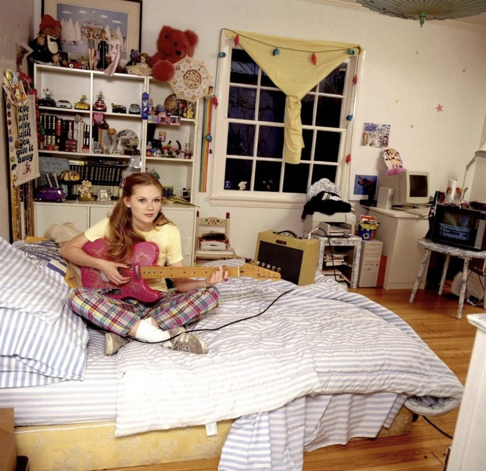 An image of a young Kirsten Dunst hanging in her room back in the '90s. 