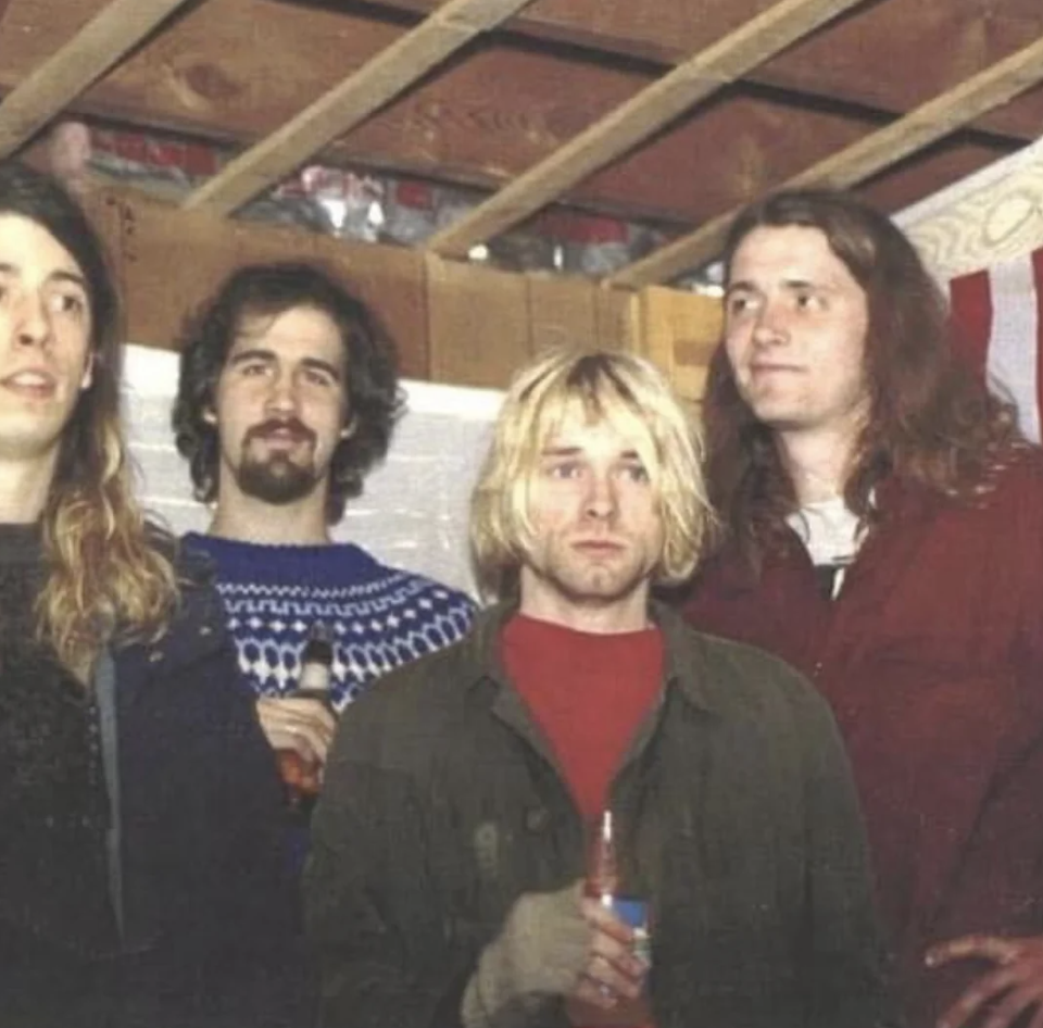 An image of someone's uncle hanging out with Nirvana before they became famous. 