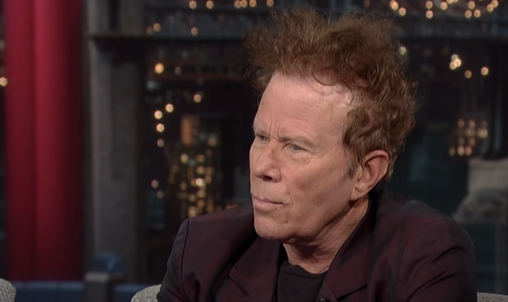 Tom Waits staring off into the distance on talk show. 