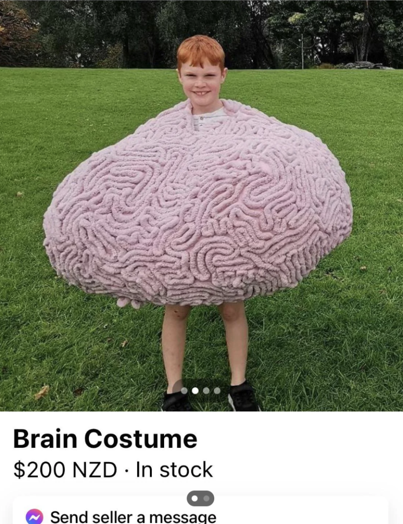 A kid that's wearing a big brain costume. 