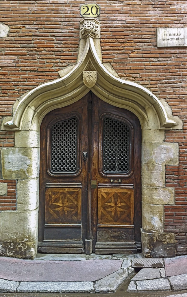 An image of the Door of the Hotel Delfau, Toulouse, France. 