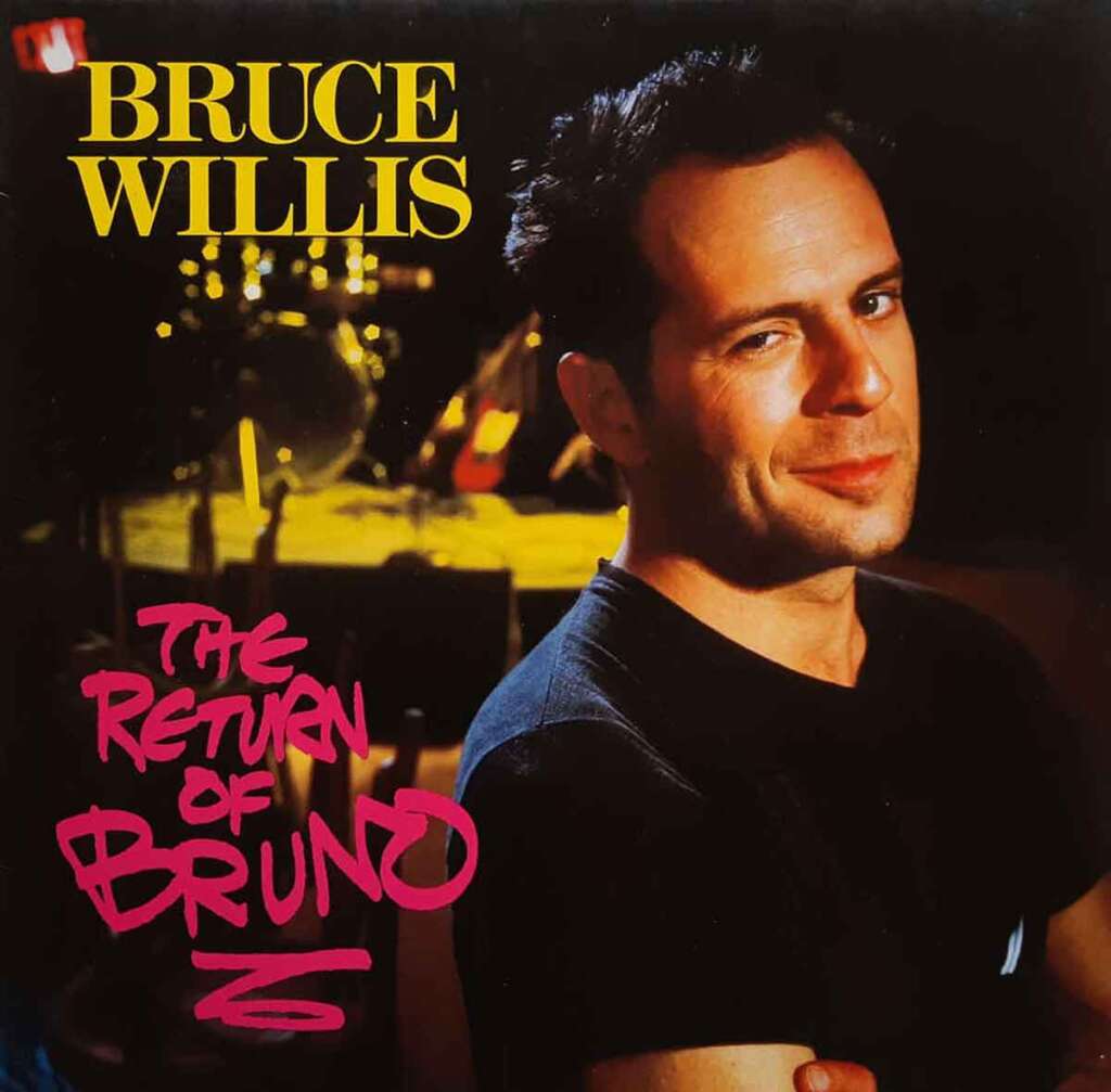 Album cover for "The Return of Bruno" featuring a photograph of a man with short dark hair, wearing a black shirt, smiling slightly at the camera. The text includes "BRUCE WILLIS" in yellow at the top left and "THE RETURN OF BRUNO" in pink at the bottom left.