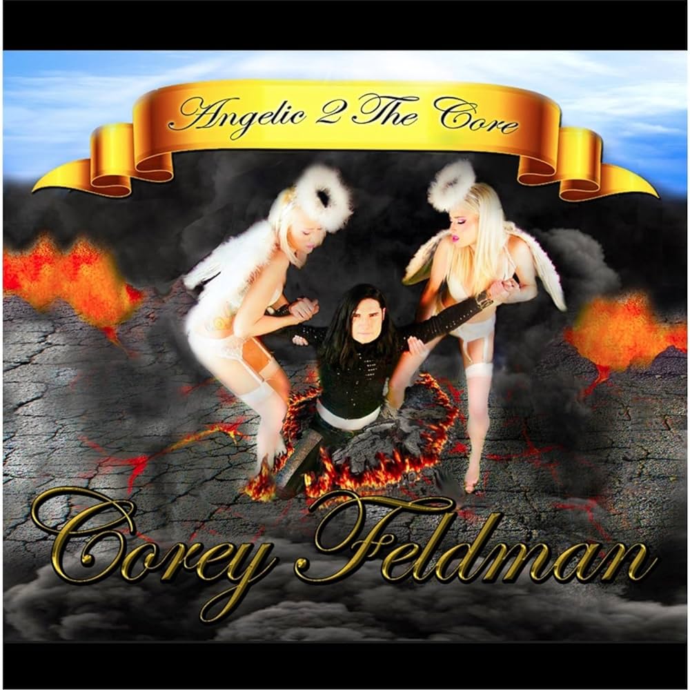 Album cover of "Angelic 2 The Core" by Corey Feldman. It shows Corey in a black outfit kneeling with a guitar while two women dressed as angels stand beside him. The background features lava and a sky with clouds and a golden ribbon displaying the album title.
