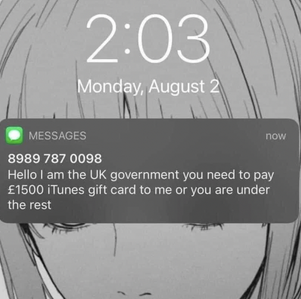 A screenshot of a phone showing a text message from the number 8989 787 0098, claiming to be from the UK government, asking for £1500 in iTunes gift cards or threatening consequences. The message appears dubious, likely indicating a scam. The time displayed is 2:03 on Monday, August 2.