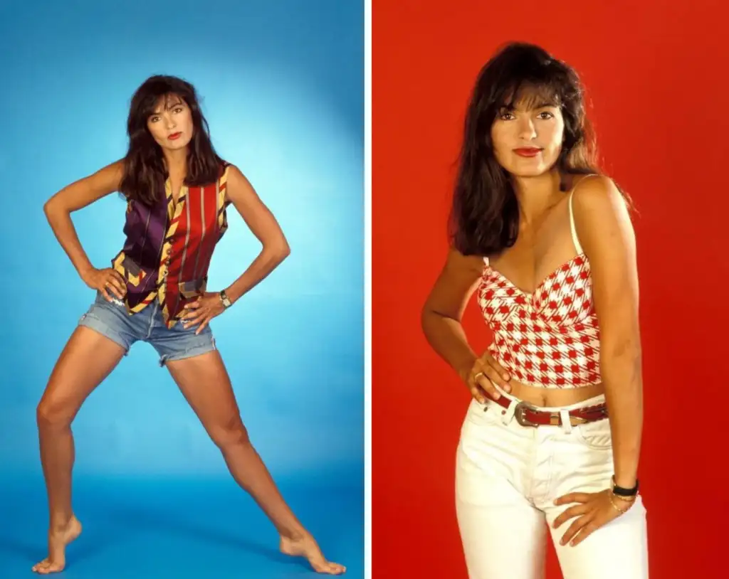 Split image of a woman posing against two different backgrounds. On the left, she stands on a blue backdrop, wearing a multicolored sleeveless top and denim shorts, barefoot. On the right, she stands on a red backdrop, wearing a red checkered crop top and white jeans.