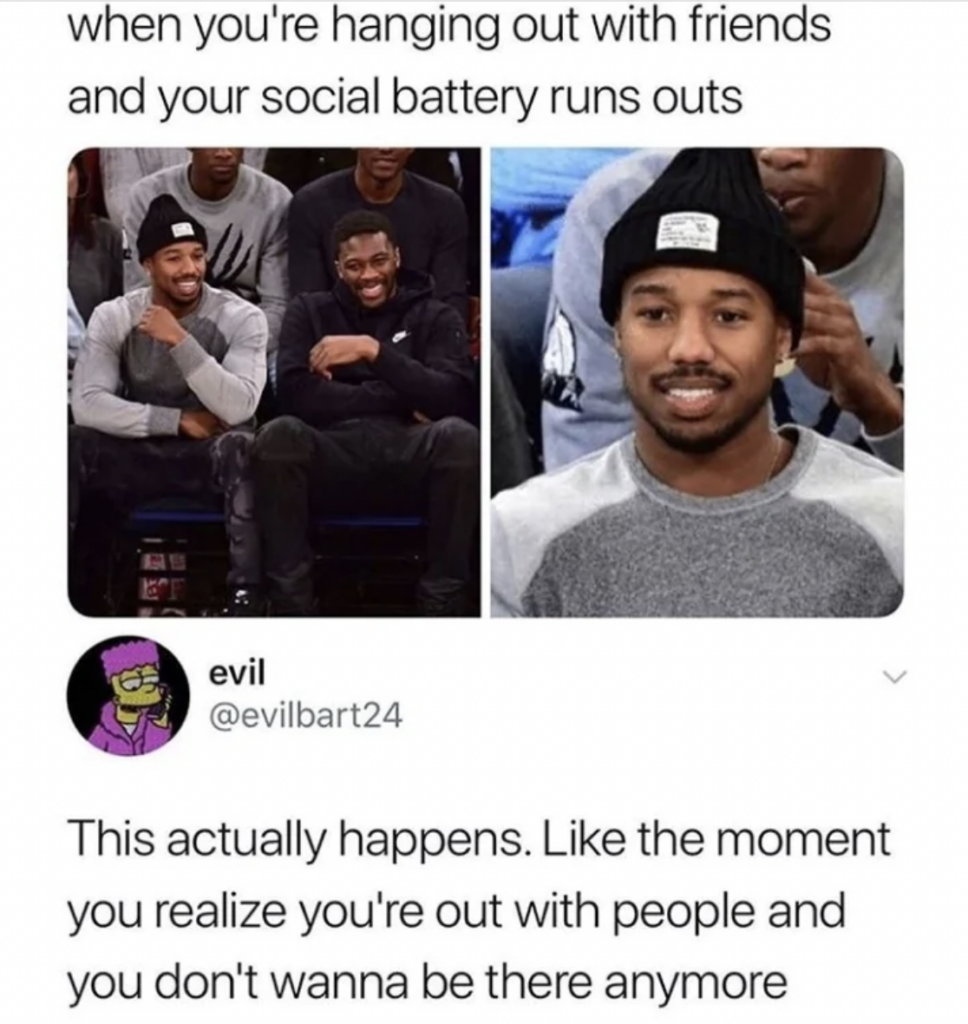 A meme featuring two images of the same man. In the first, he is smiling and laughing while sitting with a friend. In the second, he looks tired and uninterested. Caption above reads: "when you're hanging out with friends and your social battery runs out." Below is a tweet from @evilbart24: "This actually happens. Like the moment you realize you're out with people and you don't wanna be there anymore.