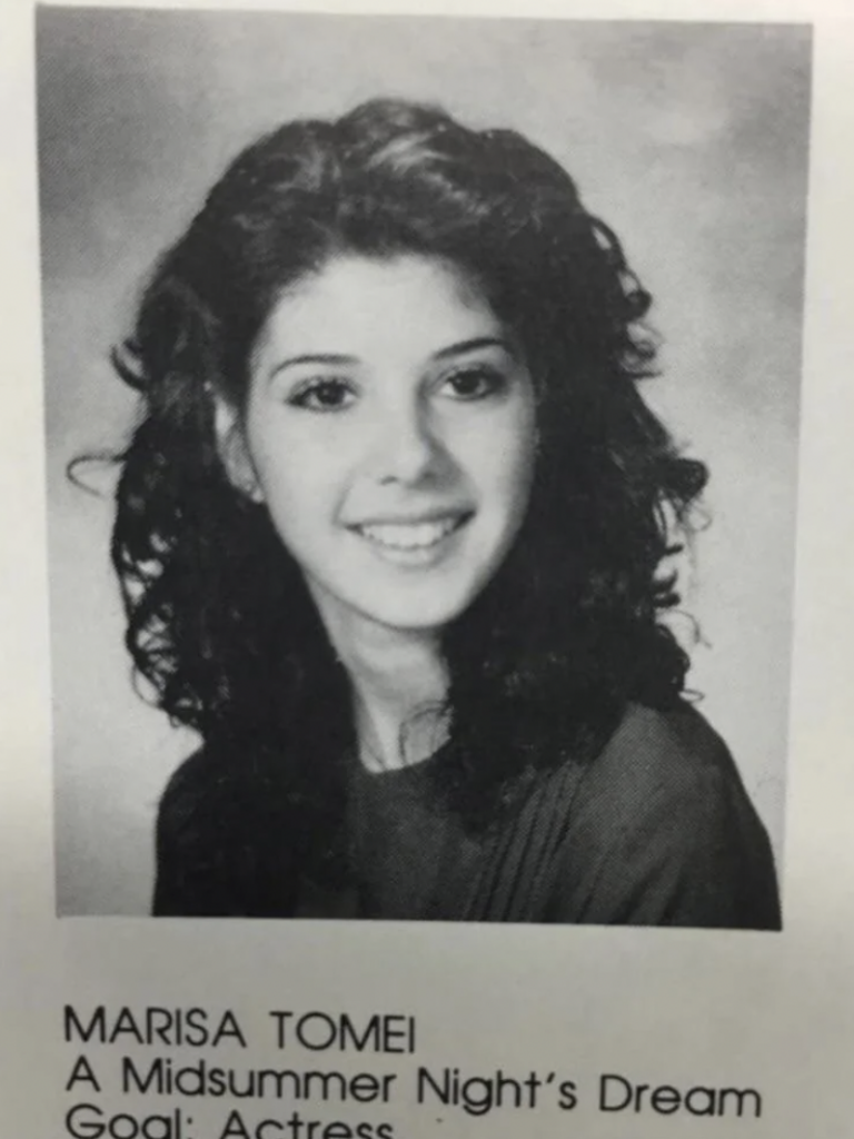A black and white yearbook photo shows a young person with curly dark hair wearing a dark top. Below the photo, text reads: "MARISA TOMEI, A Midsummer Night's Dream, Goal: Actress.
