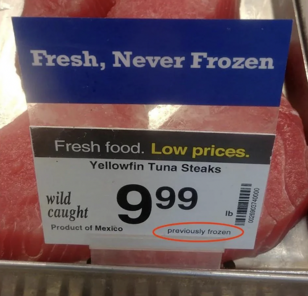 A price sign for Yellowfin Tuna Steaks at $9.99 per pound. The sign states "Fresh, Never Frozen" at the top but includes a note "previously frozen" at the bottom. The product is labeled as "wild caught" and from Mexico.
