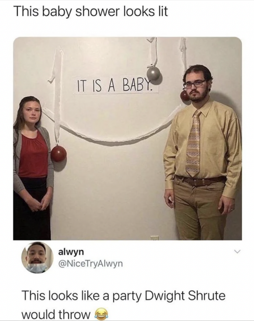 A photo features a man and woman standing in front of a plain wall with three balloons and a banner that reads "IT IS A BABY." The man wears a yellow shirt and tie; the woman wears a grey top and black skirt. A tweet below says, "This looks like a party Dwight Shrute would throw 😂.