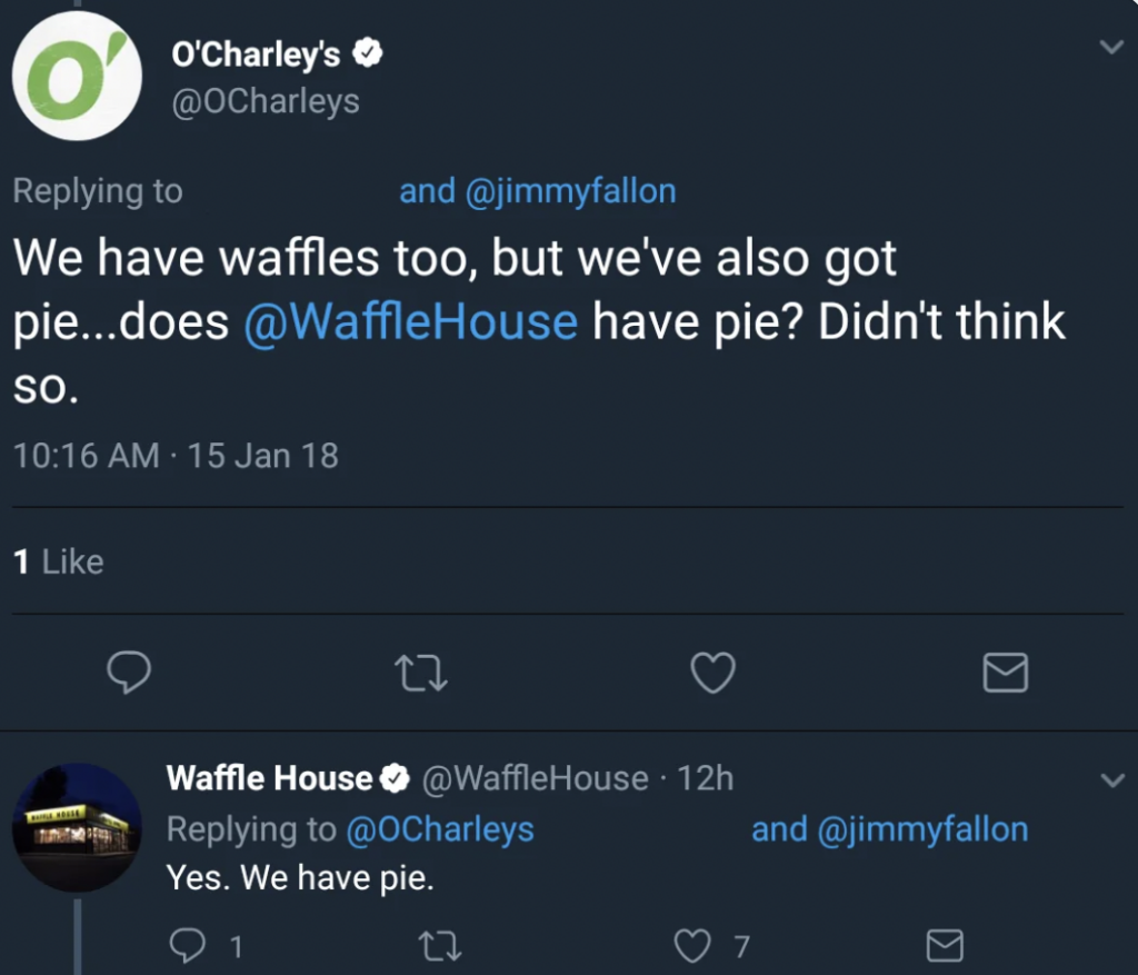 A Twitter exchange between O'Charley's and Waffle House. O'Charley's tweets at Waffle House and Jimmy Fallon, boasting about their waffles and pie. Waffle House responds simply, "Yes. We have pie." The tweets display timestamps and like counts.