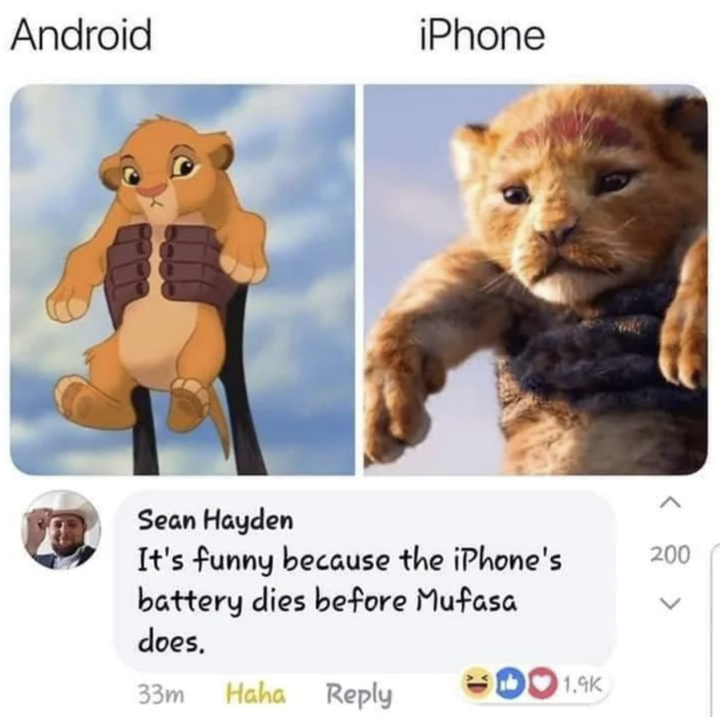 A meme comparing an animated lion cub representing Android and a realistic lion cub representing iPhone. Below, a comment reads, "It's funny because the iPhone's battery dies before Mufasa does," with engagement icons and reactions.