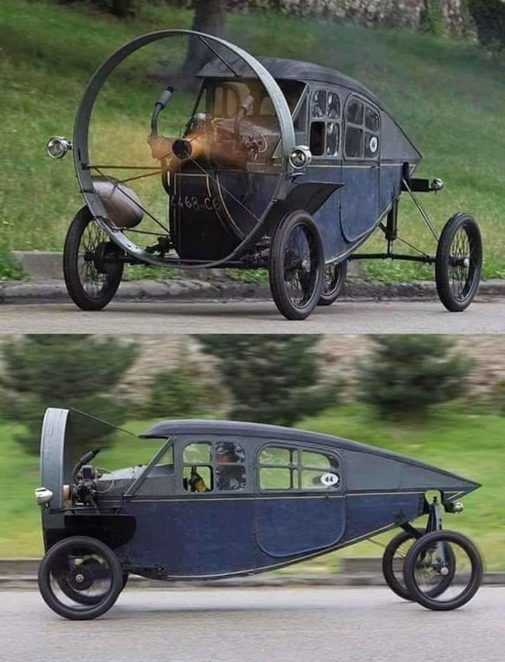 Two images of a unique, antique car featuring a large, circular propeller at the front, open cockpit, and a vintage design. The car has a sleek, enclosed body with two doors, a cylindrical tail, and large, spoked wheels with bicycle-like tires.