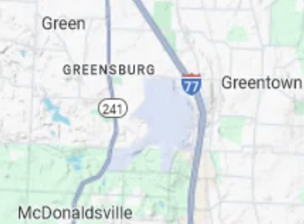 A map showing Greensburg near Interstate 77, with Greentown to the east and Green to the north. McDonaldsville is located to the southwest, near Route 241 and a large body of water in the center. The area appears mostly green with some roads and geographical features.