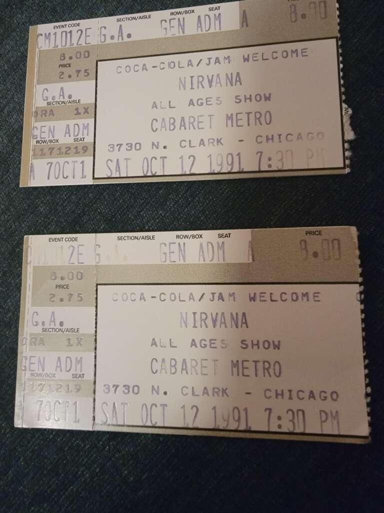 Two concert tickets for Nirvana's "All Ages Show" on Saturday, October 12, 1991, at Cabaret Metro in Chicago. The tickets display the time of 7:30 PM and indicate general admission seating.