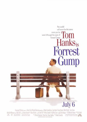 A movie poster for "Forrest Gump" shows a man in a light-colored suit sitting on a wooden bench, facing away. Beside him is a suitcase. The text reads, "The world will never be the same once you've seen it through the eyes of Forrest Gump. Tom Hanks is Forrest Gump. July 6.