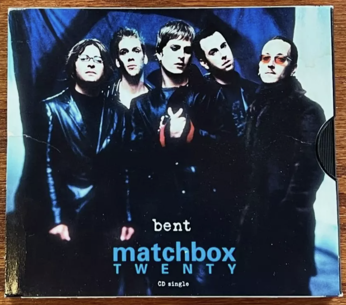 CD cover of the single "Bent" by Matchbox Twenty. The cover features the five band members standing together in dark attire against a blue backdrop. The band's name and the single title "Bent" are prominently displayed at the bottom in white and blue text.